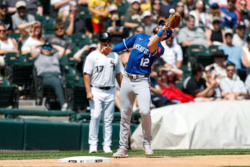 Jun 8, 2025; Chicago, Illinois, USA; Kansas City Royals third baseman Nick Loftin (12) catches a fly ball hit by Chicago White Sox designated hitter Andrew Benintendi during the sixth inning at Rate Field. Mandatory Credit: Kamil Krzaczynski-Imagn Images