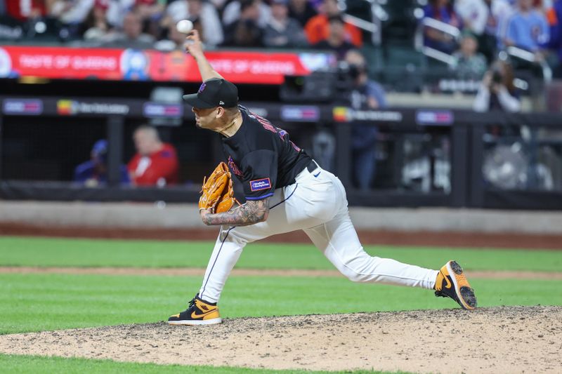 Apr 22, 2025; New York City, New York, USA;  New York Mets relief pitcher José Buttó (70) pitches in the ninth inning against the Philadelphia Phillies at Citi Field. Mandatory Credit: Wendell Cruz-Imagn Images