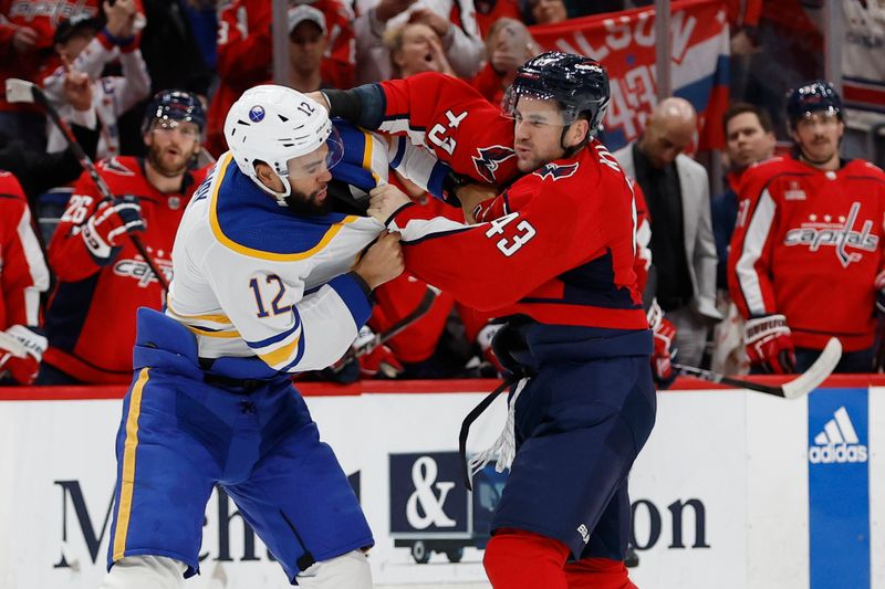 Nov 22, 2023; Washington, District of Columbia, USA; Washington Capitals right wing Tom Wilson (43) fights Buffalo Sabres left wing Jordan Greenway (12) in the first period at Capital One Arena. Mandatory Credit: Geoff Burke-USA TODAY Sports
