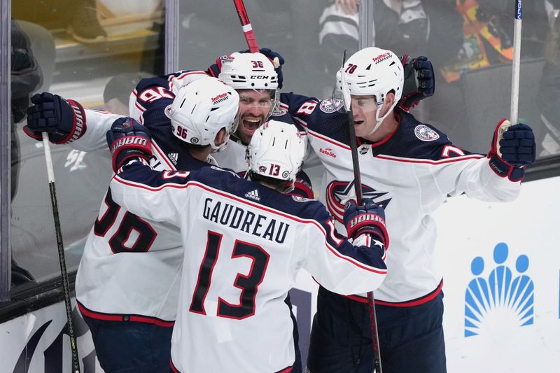 Feb 17, 2024; San Jose, California, USA; Columbus Blue Jackets center Boone Jenner (38) celebrates with center Jack Roslovic (96) and left wing Johnny Gaudreau (13) and defenseman Damon Severson (78) after scoring a goal against the San Jose Sharks during the third period at SAP Center at San Jose. Mandatory Credit: Darren Yamashita-USA TODAY Sports