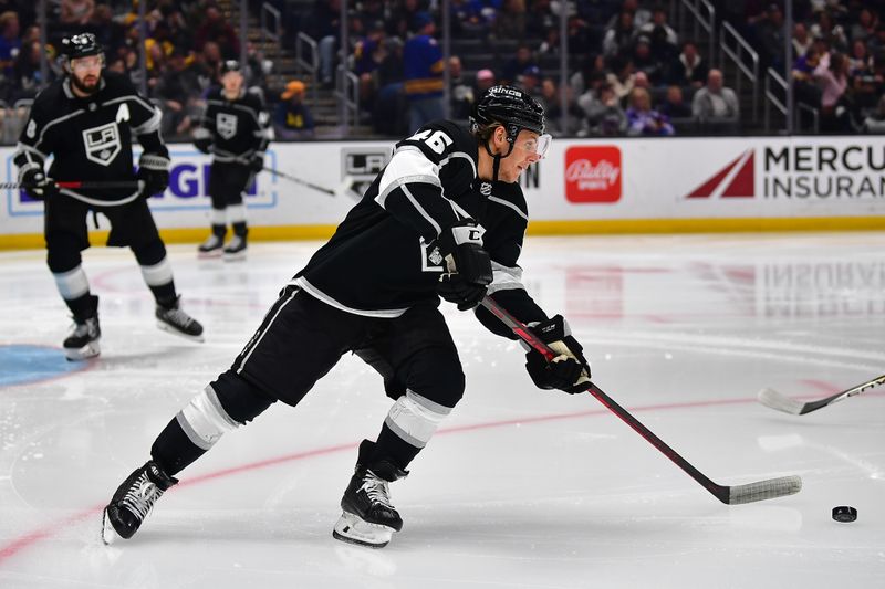 Feb 13, 2023; Los Angeles, California, USA; Los Angeles Kings center Blake Lizotte (46) moves the puck against the Buffalo Sabres during the third period at Crypto.com Arena. Mandatory Credit: Gary A. Vasquez-USA TODAY Sports