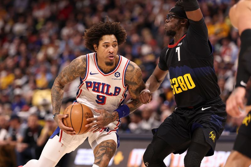 DENVER, COLORADO - JANUARY 27: Kelly Oubre Jr. #9 of the Philadelphia 76ers drives to the basket against Reggie Jackson #7 of the Denver Nuggets in the first half at Ball Arena on January 27, 2024 in Denver, Colorado. NOTE TO USER: User expressly acknowledges and agrees that, by downloading and/or using this photograph, user is consenting to the terms and conditions of the Getty Images License Agreement. (Photo by Justin Tafoya/Getty Images)