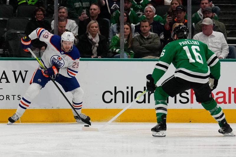 Feb 17, 2024; Dallas, Texas, USA;  Edmonton Oilers center Leon Draisaitl (29) skates with the puck against Dallas Stars center Joe Pavelski (16) during the first period at American Airlines Center. Mandatory Credit: Chris Jones-USA TODAY Sports