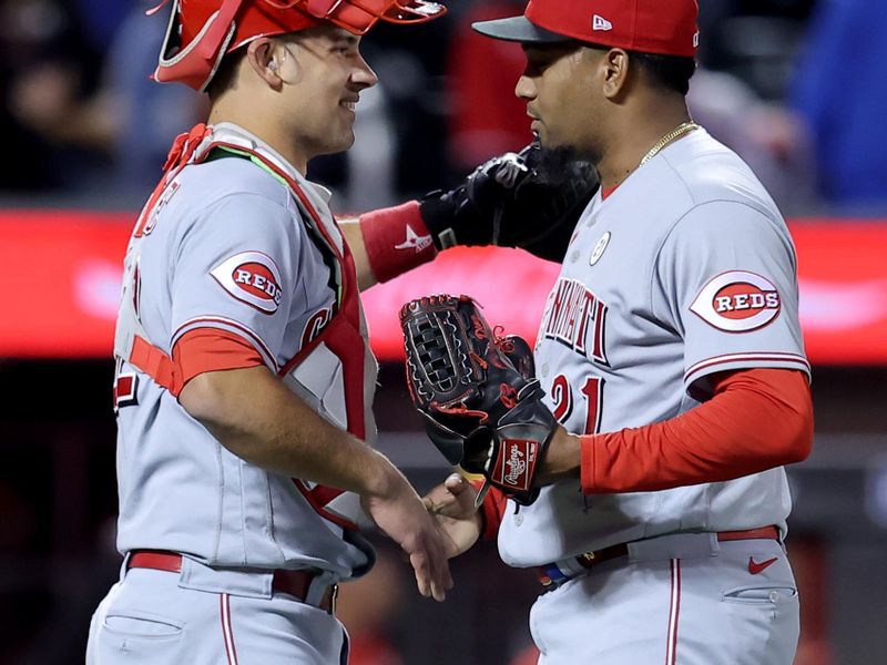 Sep 15, 2023; New York City, New York, USA; Cincinnati Reds relief pitcher Alexis Diaz (right) celebrates with catcher Luke Maile (22) after defeating the New York Mets at Citi Field. Mandatory Credit: Brad Penner-USA TODAY Sports