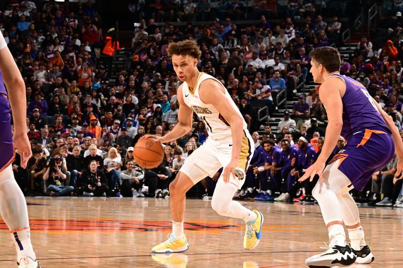 PHOENIX, AZ - APRIL 7: Dyson Daniels #11 of the New Orleans Pelicans handles the ball during the game against the Phoenix Suns on April 7, 2024 at Footprint Center in Phoenix, Arizona. NOTE TO USER: User expressly acknowledges and agrees that, by downloading and or using this photograph, user is consenting to the terms and conditions of the Getty Images License Agreement. Mandatory Copyright Notice: Copyright 2024 NBAE (Photo by Kate Frese/NBAE via Getty Images)