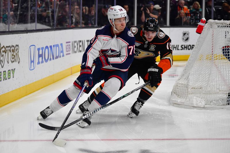 Feb 21, 2024; Anaheim, California, USA; Columbus Blue Jackets defenseman Damon Severson (78) moves the puck against Anaheim Ducks right wing Troy Terry (19) during the first period at Honda Center. Mandatory Credit: Gary A. Vasquez-USA TODAY Sports