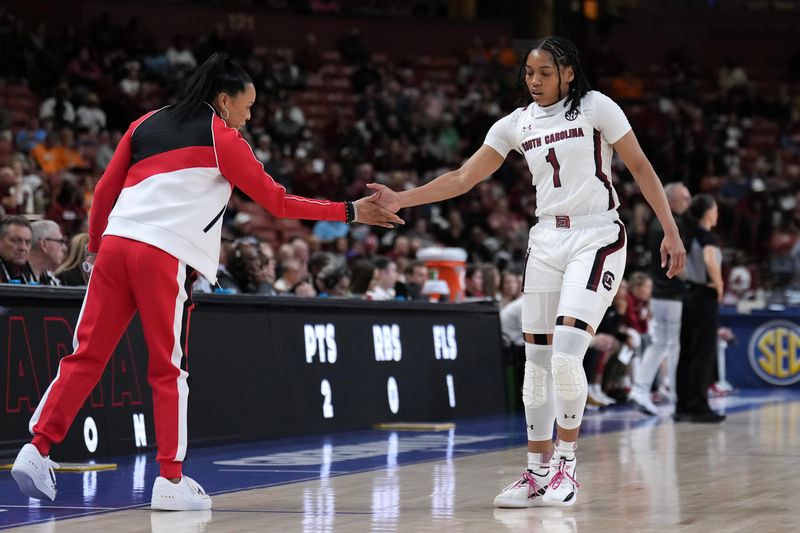 Mar 3, 2023; Greenville, SC, USA; South Carolina Gamecocks head coach Dawn Staley gives a hand slap to guard Zia Cooke (1) in the first quarter at Bon Secours Wellness Arena. Mandatory Credit: David Yeazell-USA TODAY Sports