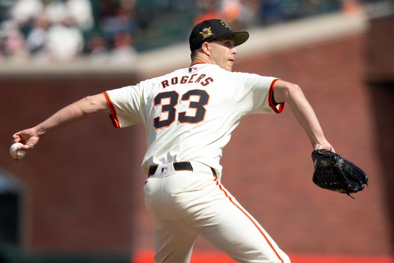 May 18, 2024; San Francisco, California, USA; San Francisco Giants pitcher Taylor Rogers (33) delivers a pitch against the Colorado Rockies during the ninth inning at Oracle Park. Mandatory Credit: D. Ross Cameron-USA TODAY Sports