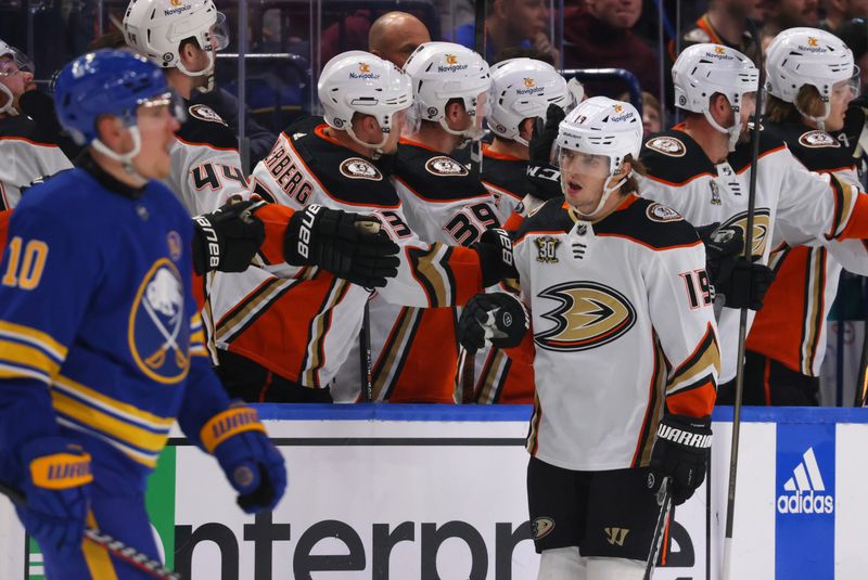 Feb 19, 2024; Buffalo, New York, USA;  Anaheim Ducks right wing Troy Terry (19) celebrates his goal with teammates during the second period against the Buffalo Sabres at KeyBank Center. Mandatory Credit: Timothy T. Ludwig-USA TODAY Sports