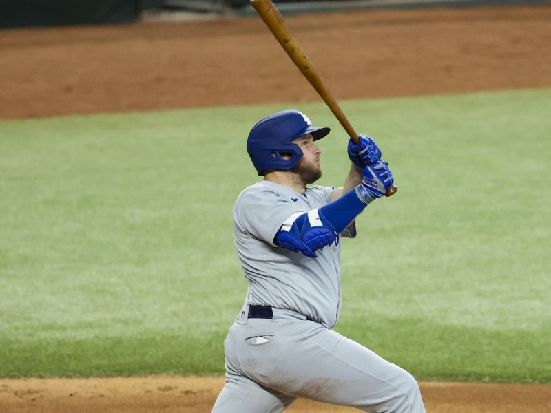 Jul 23, 2023; Arlington, Texas, USA;  Los Angeles Dodgers third baseman Max Muncy (13) hits a grand slam during the first inning against the Texas Rangers at Globe Life Field. Mandatory Credit: Kevin Jairaj-USA TODAY Sports