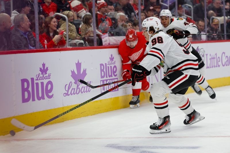 Nov 30, 2023; Detroit, Michigan, USA;  Chicago Blackhawks center Connor Bedard (98) skates with the puck in the first period against the Detroit Red Wings at Little Caesars Arena. Mandatory Credit: Rick Osentoski-USA TODAY Sports