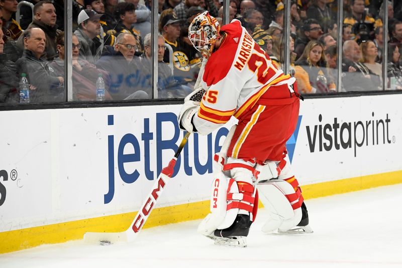 Feb 6, 2024; Boston, Massachusetts, USA; Calgary Flames goaltender Jacob Markstrom (25) handles the puck during the third period against the Boston Bruins at TD Garden. Mandatory Credit: Bob DeChiara-USA TODAY Sports