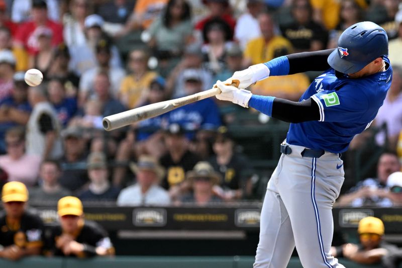 Mar 25, 2024; Bradenton, Florida, USA; Toronto Blue Jays second baseman Cavan Biggio (8) hits a RBI triple in the second inning of the spring training game against the Pittsburgh Pirates at LECOM Park. Mandatory Credit: Jonathan Dyer-USA TODAY Sports