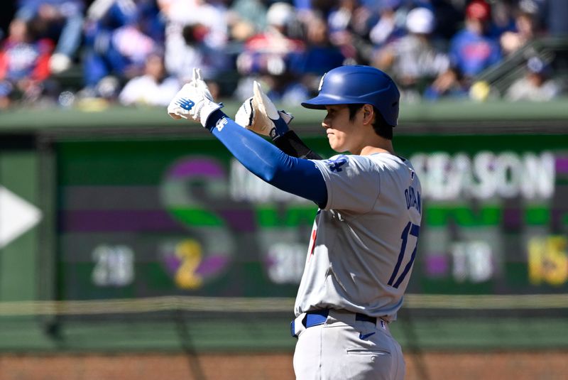 Apr 6, 2024; Chicago, Illinois, USA;  Los Angeles Dodgers two-way player Shohei Ohtani (17) signals against the Chicago Cubs after making it to second base during the first inning at Wrigley Field. Mandatory Credit: Matt Marton-USA TODAY Sports