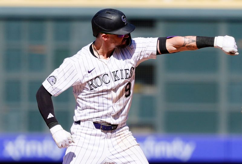 Apr 10, 2025; Denver, Colorado, USA; Colorado Rockies outfielder Brenton Doyle (9) reacts after a two run double against the Milwaukee Brewers  at Coors Field. Mandatory Credit: Ron Chenoy-Imagn Images