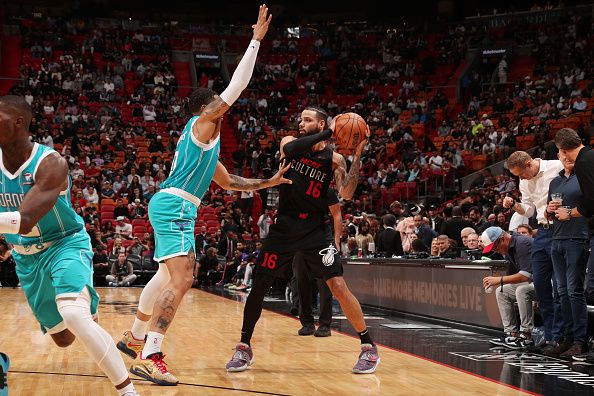 MIAMI, FL - DECEMBER 13: Caleb Martin #16 of the Miami Heat looks to pass the ball during the game against the Charlotte Hornets on December 13, 2023 at Kaseya Center in Miami, Florida. NOTE TO USER: User expressly acknowledges and agrees that, by downloading and or using this Photograph, user is consenting to the terms and conditions of the Getty Images License Agreement. Mandatory Copyright Notice: Copyright 2023 NBAE (Photo by Issac Baldizon/NBAE via Getty Images)