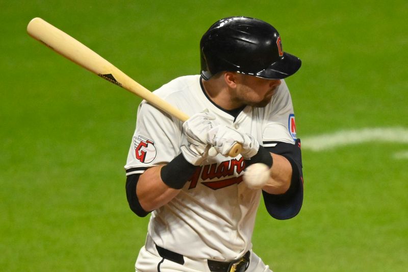 Aug 14, 2024; Cleveland, Ohio, USA; Cleveland Guardians center fielder Lane Thomas (8) is hit by a pitch in the eighth inning against the Chicago Cubs at Progressive Field. Mandatory Credit: David Richard-USA TODAY Sports