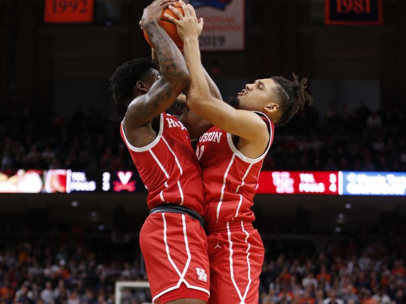 Dec 17, 2022; Charlottesville, Virginia, USA; Virginia Cavaliers forward Kadin Shedrick (21) and Virginia Cavaliers forward Jayden Gardner (1) battle for a rebound against the Virginia Cavaliers during the second half at John Paul Jones Arena. Mandatory Credit: Amber Searls-USA TODAY Sports