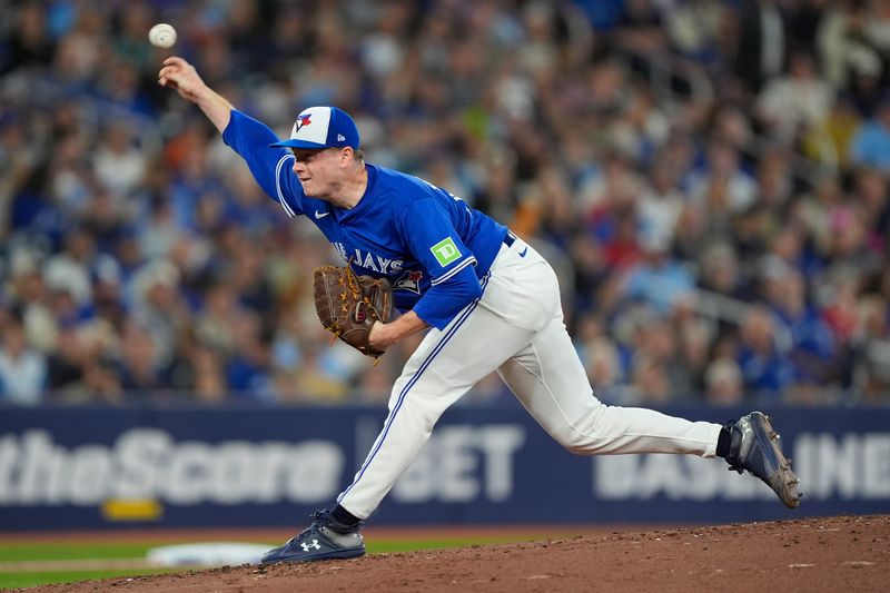 Sep 25, 2025; Toronto, Ontario, CAN; Toronto Blue Jays starting pitcher Louie Varland (77) pitches to the Boston Red Sox during the second inning at Rogers Centre. Mandatory Credit: John E. Sokolowski-Imagn Images