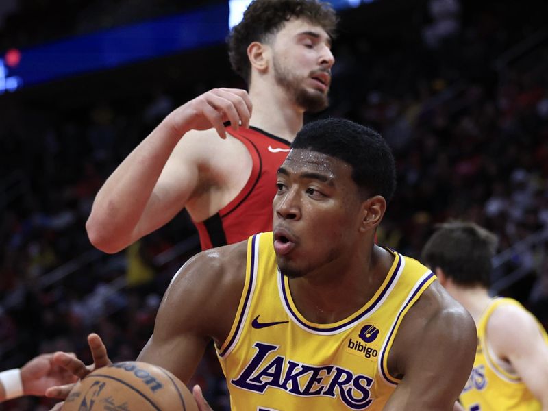 HOUSTON, TEXAS - JANUARY 29: Rui Hachimura #28 of the Los Angeles Lakers controls the ball ahead of Alperen Sengun #28 of the Houston Rockets during the second half at Toyota Center on January 29, 2024 in Houston, Texas. NOTE TO USER: User expressly acknowledges and agrees that, by downloading and or using this photograph, User is consenting to the terms and conditions of the Getty Images License Agreement.? (Photo by Carmen Mandato/Getty Images)