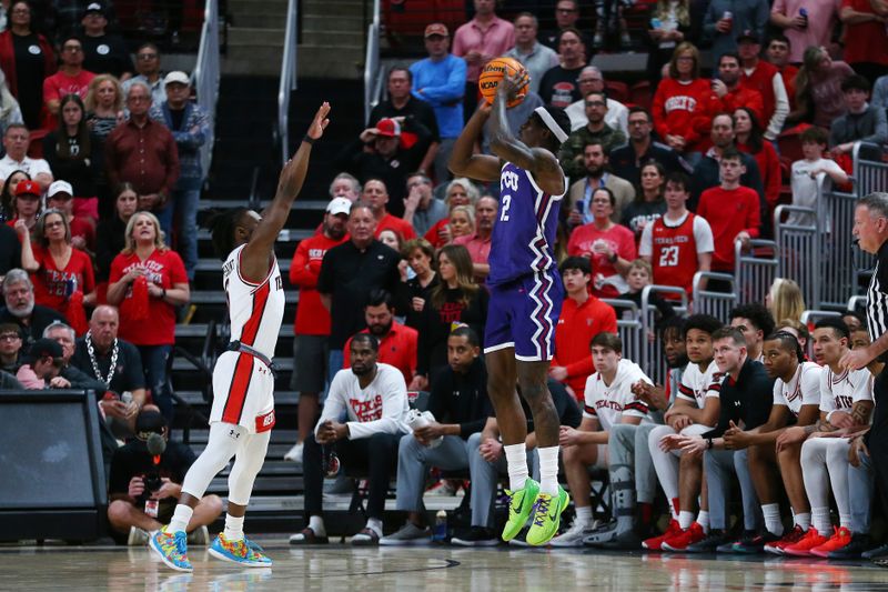 Feb 20, 2024; Lubbock, Texas, USA;  TCU Horned Frogs forward Emanuel Miller (2) shoots over Texas Tech Red Raiders guard Joe Toussaint (6) in the first half at United Supermarkets Arena. Mandatory Credit: Michael C. Johnson-USA TODAY Sports