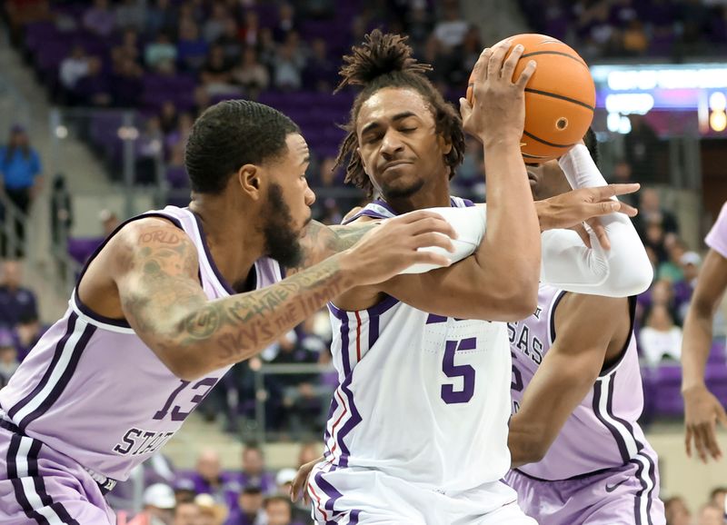 Jan 14, 2023; Fort Worth, Texas, USA;  TCU Horned Frogs forward Chuck O'Bannon Jr. (5) tries to control the ball as Kansas State Wildcats guard Desi Sills (13) and Kansas State Wildcats guard Cam Carter (5) defend during the first half at Ed and Rae Schollmaier Arena. Mandatory Credit: Kevin Jairaj-USA TODAY Sports