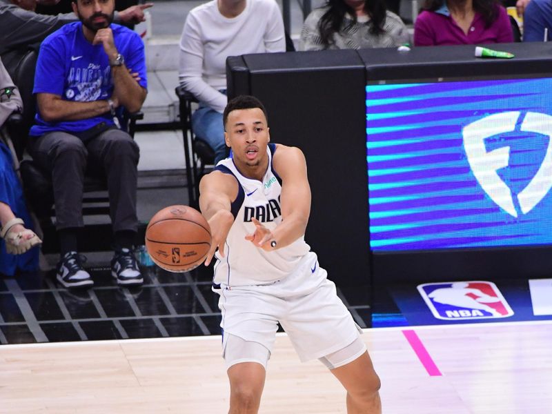 LOS ANGELES, CA - APRIL 23: Dante Exum #0 of the Dallas Mavericks passes the ball during the game against the LA Clippers during Round 1 Game 2 of the 2024 NBA Playoffs on April 23, 2024 at Crypto.Com Arena in Los Angeles, California. NOTE TO USER: User expressly acknowledges and agrees that, by downloading and/or using this Photograph, user is consenting to the terms and conditions of the Getty Images License Agreement. Mandatory Copyright Notice: Copyright 2024 NBAE (Photo by Adam Pantozzi/NBAE via Getty Images)