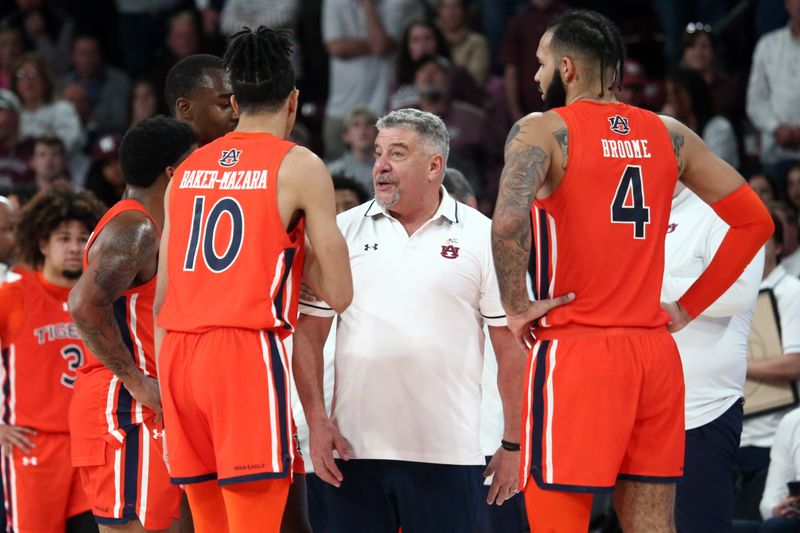 Jan 27, 2024; Starkville, Mississippi, USA; Auburn Tigers head coach Bruce Pearl (middle) huddles with his team during a time out during the second half against the Mississippi State Bulldogs at Humphrey Coliseum. Mandatory Credit: Petre Thomas-USA TODAY Sports