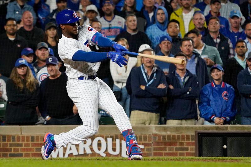 Sep 19, 2023; Chicago, Illinois, USA; Chicago Cubs designated hitter Alexander Canario (4) hits a grand slam home run against the Pittsburgh Pirates during the eighth inning at Wrigley Field. Mandatory Credit: David Banks-USA TODAY Sports