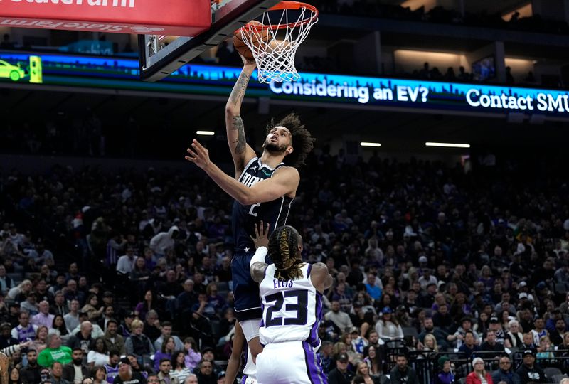 SACRAMENTO, CALIFORNIA - MARCH 29: Dereck Lively II #2 of the Dallas Mavericks shoots over Keon Ellis #23 of the Sacramento Kings during the first half at Golden 1 Center on March 29, 2024 in Sacramento, California. NOTE TO USER: User expressly acknowledges and agrees that, by downloading and or using this photograph, User is consenting to the terms and conditions of the Getty Images License Agreement. (Photo by Thearon W. Henderson/Getty Images)