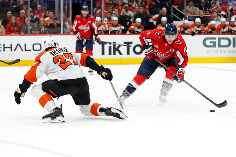 Oct 23, 2024; Washington, District of Columbia, USA; Washington Capitals defenseman Jakob Chychrun (6) skates with the puck as Philadelphia Flyers left wing Noah Cates (27) defends in the first period at Capital One Arena. Mandatory Credit: Geoff Burke-Imagn Images