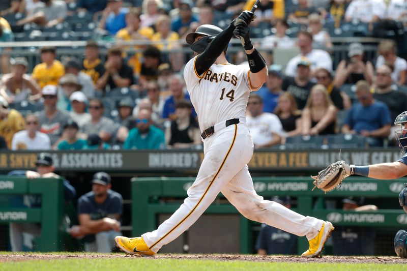 Aug 18, 2024; Pittsburgh, Pennsylvania, USA;  Pittsburgh Pirates catcher Joey Bart (14) hits a two run home run against the Seattle Mariners during the sixth inning at PNC Park. Mandatory Credit: Charles LeClaire-USA TODAY Sports