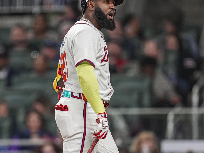 Apr 23, 2024; Cumberland, Georgia, USA; Atlanta Braves designated hitter Marcell Ozuna (20) reacts after being called out on strikes against the Miami Marlins during the seventh inning at Truist Park. Mandatory Credit: Dale Zanine-USA TODAY Sports