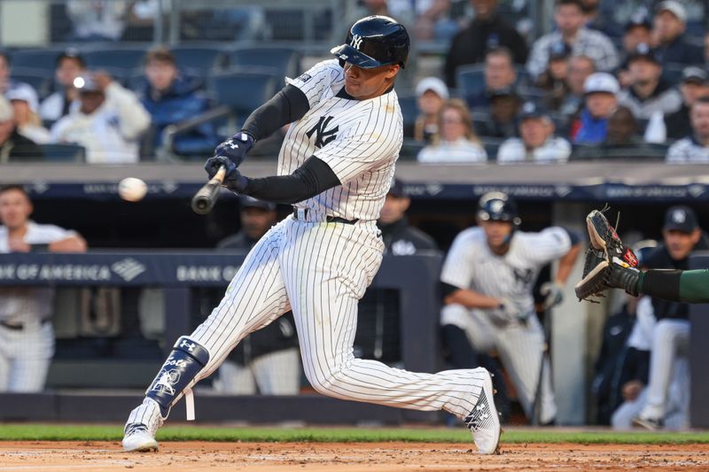 Apr 23, 2024; Bronx, New York, USA;  New York Yankees outfielder Juan Soto (22) singles during the first inning against the Oakland Athletics at Yankee Stadium. Mandatory Credit: Vincent Carchietta-USA TODAY Sports