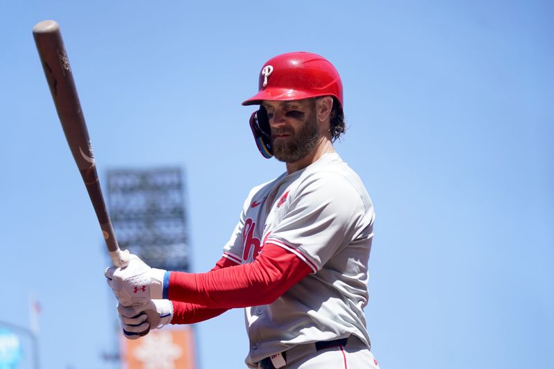 May 27, 2024; San Francisco, California, USA; Philadelphia Phillies first baseman Bryce Harper (3) walks towards the on deck circle against the San Francisco Giants in the fourth inning at Oracle Park. Mandatory Credit: Cary Edmondson-USA TODAY Sports