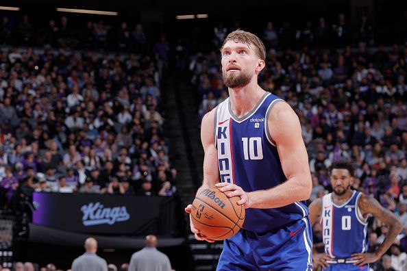 SACRAMENTO, CA - DECEMBER 2: Domantas Sabonis #10 of the Sacramento Kings prepares to shoot a free throw while Malik Monk #0 looks on during the game against the Denver Nuggets on December 2, 2023 at Golden 1 Center in Sacramento, California. NOTE TO USER: User expressly acknowledges and agrees that, by downloading and or using this Photograph, user is consenting to the terms and conditions of the Getty Images License Agreement. Mandatory Copyright Notice: Copyright 2023 NBAE (Photo by Rocky Widner/NBAE via Getty Images)