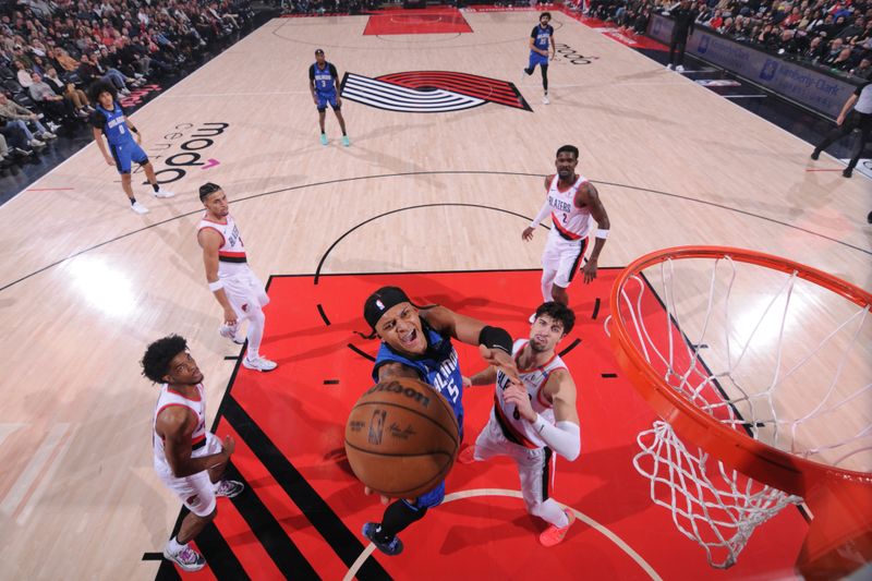 PORTLAND, OR - JANUARY 30:   Paolo Banchero #5 of the Orlando Magic drives to the basket during the game against the Portland Trail Blazers on January 30, 2025 at the Moda Center Arena in Portland, Oregon. NOTE TO USER: User expressly acknowledges and agrees that, by downloading and or using this photograph, user is consenting to the terms and conditions of the Getty Images License Agreement. Mandatory Copyright Notice: Copyright 2025 NBAE (Photo by Cameron Browne/NBAE via Getty Images)