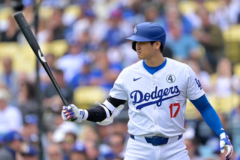 Jun 2, 2024; Los Angeles, California, USA;  Los Angeles Dodgers two-way player Shohei Ohtani (17) on deck in the first inning against the Colorado Rockies at Dodger Stadium. Mandatory Credit: Jayne Kamin-Oncea-USA TODAY Sports