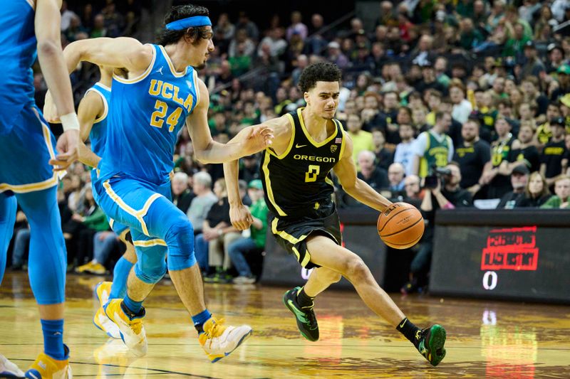 Feb 11, 2023; Eugene, Oregon, USA; Oregon Ducks guard Will Richardson (0) drives to the basket during the first half against UCLA Bruins guard Jaime Jaquez Jr. (24) at Matthew Knight Arena. Mandatory Credit: Troy Wayrynen-USA TODAY Sports