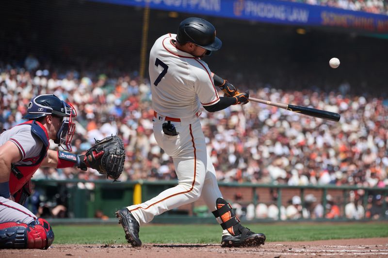 Aug 26, 2023; San Francisco, California, USA; San Francisco Giants infielder J.D. Davis (7) hits a double against the Atlanta Braves during the second inning at Oracle Park. Mandatory Credit: Robert Edwards-USA TODAY Sports