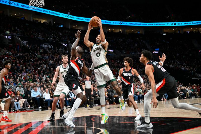 PORTLAND, OREGON - MARCH 11: Jayson Tatum #0 of the Boston Celtics drives to the basket during the first quarter against the Portland Trail Blazers at the Moda Center on March 11, 2024 in Portland, Oregon. NOTE TO USER: User expressly acknowledges and agrees that, by downloading and or using this photograph, User is consenting to the terms and conditions of the Getty Images License Agreement. (Photo by Alika Jenner/Getty Images)