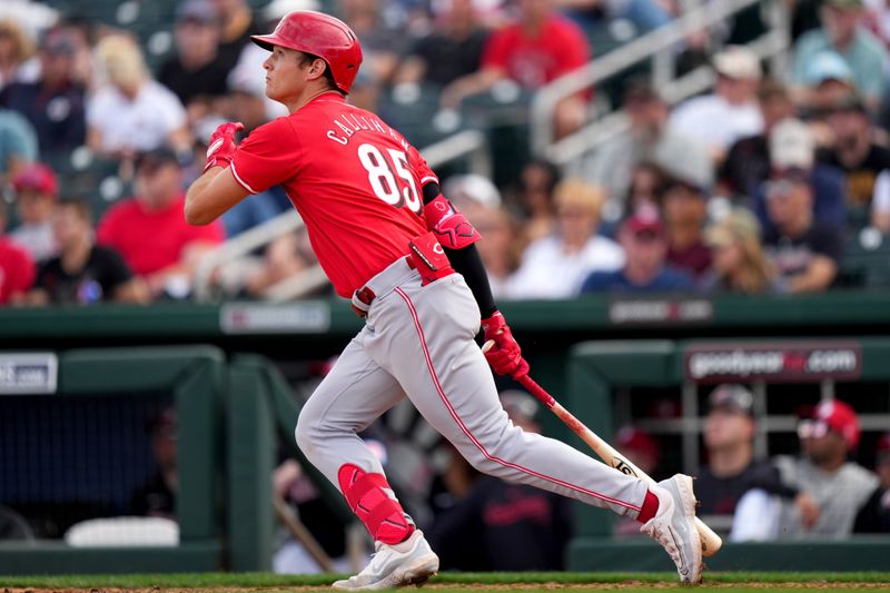 Feb. 24, 2024; Goodyear, Arizona, USA; Cincinnati Reds infielder Tyler Callihan hits a two-run home run in the eighth inning during a MLB spring training baseball game against the Cleveland Guardians at Goodyear Ballpark. Mandatory Credit: Kareem Elgazzar-USA TODAY Sports