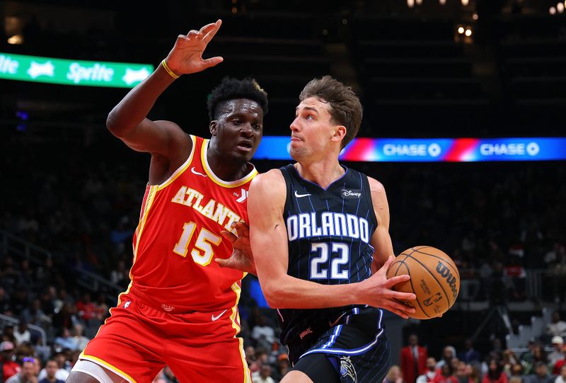 ATLANTA, GEORGIA - FEBRUARY 25:  Franz Wagner #22 of the Orlando Magic drives against Clint Capela #15 of the Atlanta Hawks during the first quarter at State Farm Arena on February 25, 2024 in Atlanta, Georgia.  NOTE TO USER: User expressly acknowledges and agrees that, by downloading and/or using this photograph, user is consenting to the terms and conditions of the Getty Images License Agreement.  (Photo by Kevin C. Cox/Getty Images)