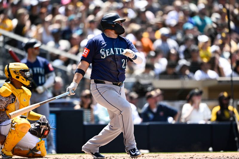 May 18, 2025; San Diego, California, USA; Seattle Mariners first baseman Rowdy Tellez (23) hits a double during the fourth inning against the San Diego Padres at Petco Park. Mandatory Credit: Denis Poroy-Imagn Images