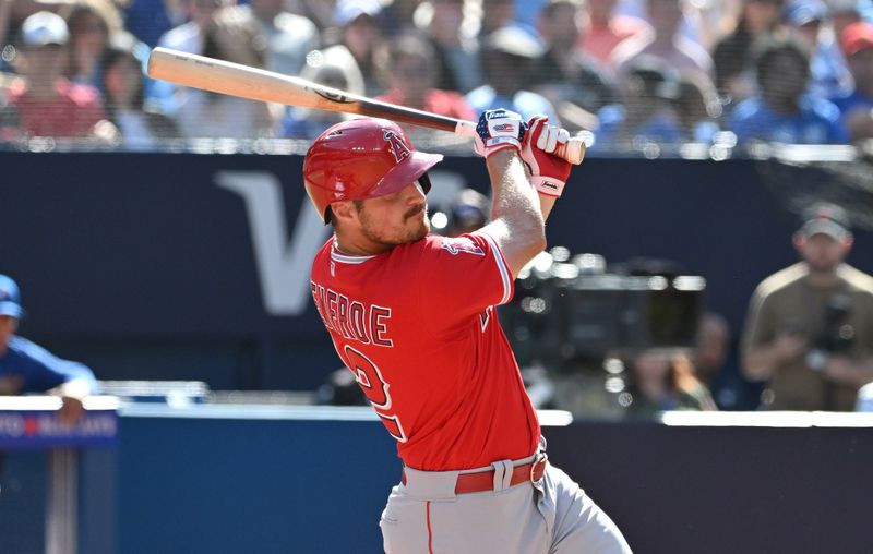 Jul 29, 2023; Toronto, Ontario, CAN;  Los Angeles Angels right fielder Hunter Renfroe (12) hits a double against the Toronto Blue Jays in the sixth inning at Rogers Centre. Mandatory Credit: Dan Hamilton-USA TODAY Sports