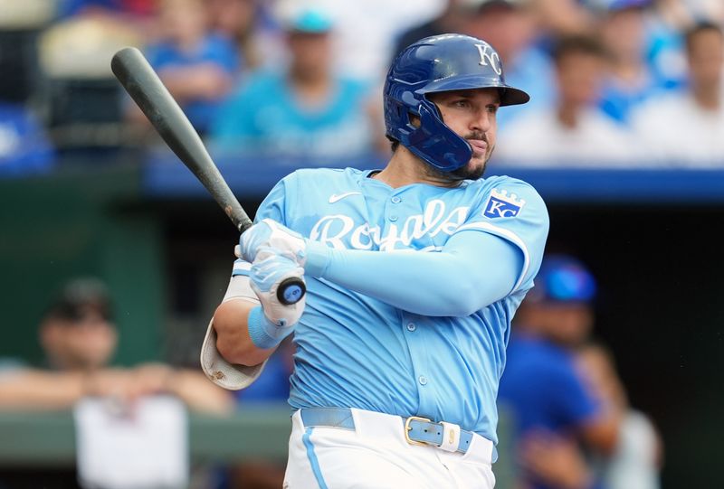 Jul 28, 2024; Kansas City, Missouri, USA; Kansas City Royals first baseman Vinnie Pasquantino (9) hits a single during the third inning against the Chicago Cubs at Kauffman Stadium. Mandatory Credit: Jay Biggerstaff-USA TODAY Sports