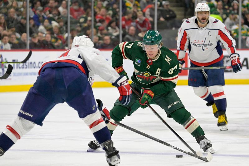 Jan 23, 2024; Saint Paul, Minnesota, USA;  Minnesota Wild forward Kirill Kaprizov (97) controls the puck against the Washington Capitals during the second period at Xcel Energy Center. Mandatory Credit: Nick Wosika-USA TODAY Sports