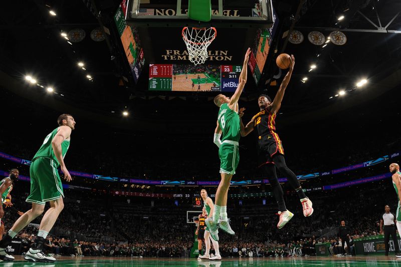 BOSTON, MA - FEBRUARY 7: De'Andre Hunter #12 of the Atlanta Hawks drives to the basket during the game against the Boston Celtics on February 7, 2024 at the TD Garden in Boston, Massachusetts. NOTE TO USER: User expressly acknowledges and agrees that, by downloading and or using this photograph, User is consenting to the terms and conditions of the Getty Images License Agreement. Mandatory Copyright Notice: Copyright 2024 NBAE  (Photo by Brian Babineau/NBAE via Getty Images)