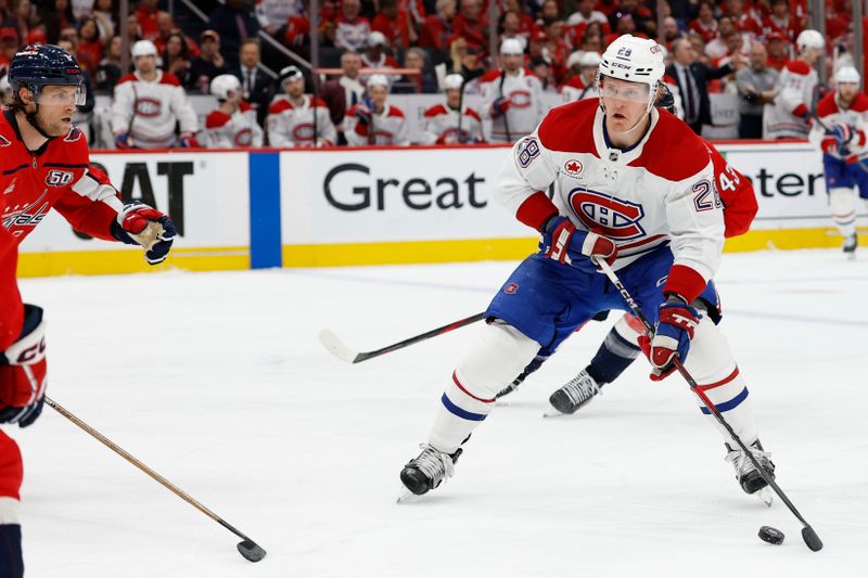 Apr 30, 2025; Washington, District of Columbia, USA; Montreal Canadiens center Christian Dvorak (28) skates with the puck as /Washington Capitals right wing Tom Wilson (43) chases in the second period in game five of the first round of the 2025 Stanley Cup Playoffs at Capital One Arena. Mandatory Credit: Geoff Burke-Imagn Images