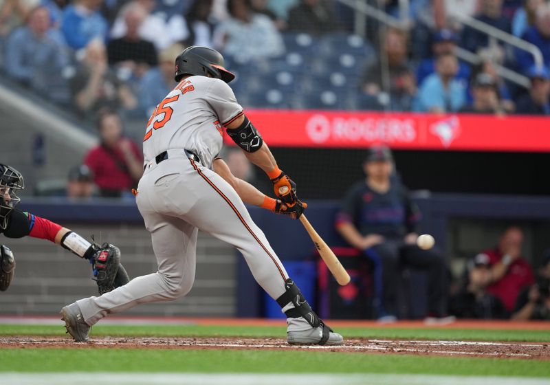 Jun 3, 2024; Toronto, Ontario, CAN; Baltimore Orioles right fielder Anthony Santander (25) hits a single against the Toronto Blue Jays during the fourth inning at Rogers Centre. Mandatory Credit: Nick Turchiaro-USA TODAY Sports